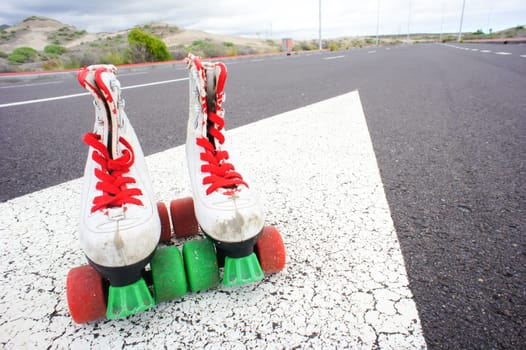 Old Vintage White Skate Boot on the Asphalt Sterret
