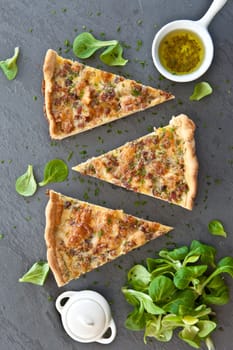 Rustic slate with quiche Lorraine and lamb's lettuce
