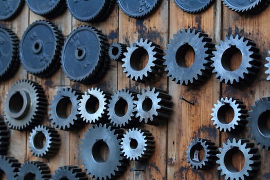 Old gears sorted on a wall