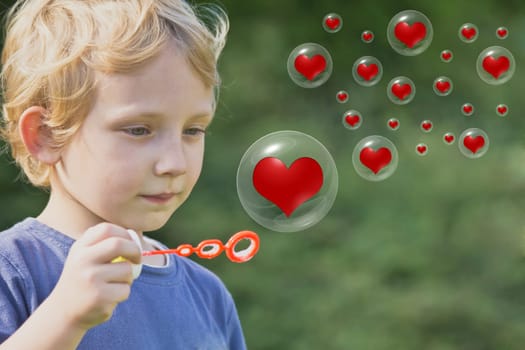 The blond boy is playing with soap bubbles, in which are red hearts