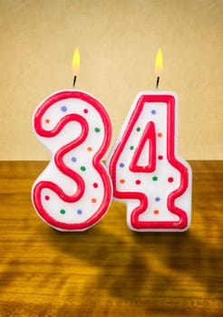 Burning birthday candles number 34