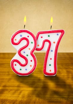 Burning birthday candles number 37