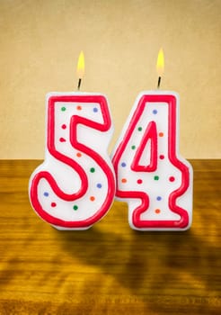 Burning birthday candles number 54