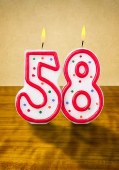 Burning birthday candles number 58
