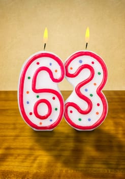 Burning birthday candles number 63