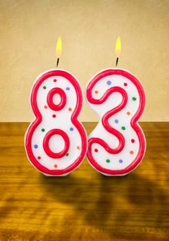 Burning birthday candles number 83