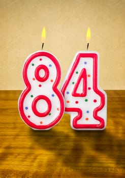 Burning birthday candles number 84