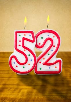 Burning birthday candles number 52