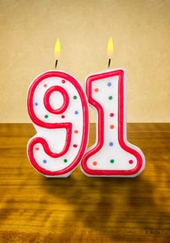 Burning birthday candles number 91