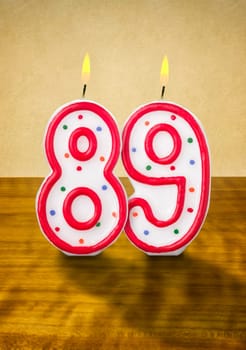 Burning birthday candles number 89