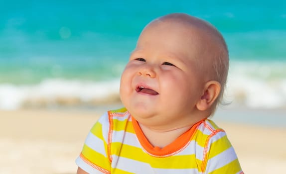 Cute baby on the tropical beach