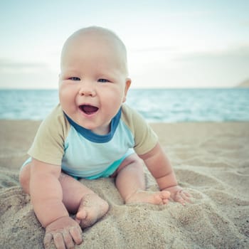 Cute baby on the tropical beach