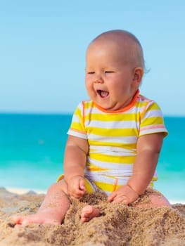 Cute baby on the tropical beach