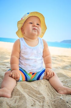 Cute baby on the tropical beach