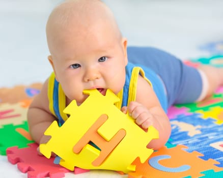 Cute baby is playing toy
