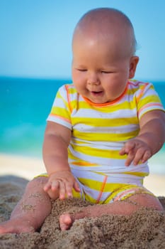Cute baby on the tropical beach