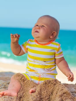 Cute baby on the tropical beach