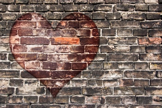 Image of the heart on the old broken brick wall