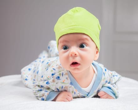 2 months baby boy doing tummy time at home.