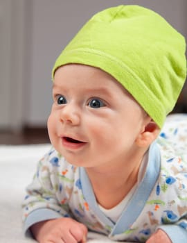 2 months baby boy doing tummy time at home.