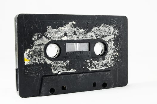 Ancient Vintage Used Musicassette over a White Background