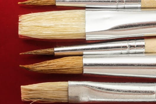 New Wooden Different Paintbrush Set Texture over a Colored Background