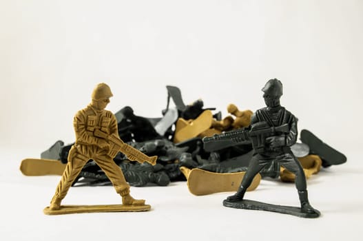 Plastic Lead Soldiers Representing War on a White Background