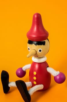 Pinocchio Toy Statue on a Colored Background