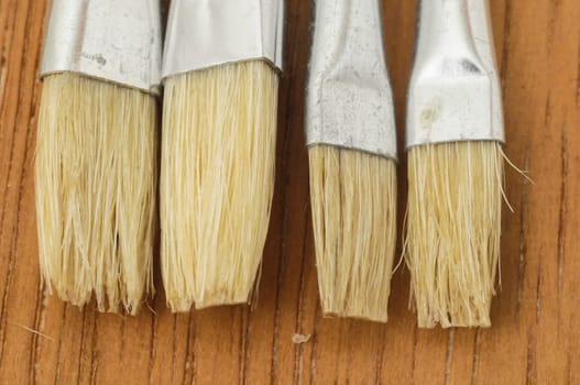 New Wooden Different Paintbrush Set Texture over a Colored Background