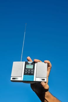 Old Vintage Two Speakers Gray Radio on the blue sky