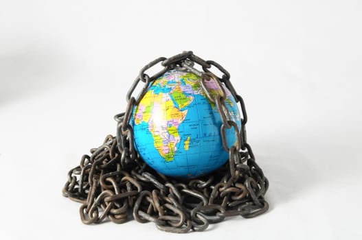 Earth globe close in chain and padlock