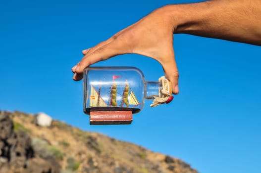Sailing Boat Vintage Vessel on a Caucasian Hand