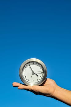Time Concept White Sand Hourglass on the Volcanic Rocks