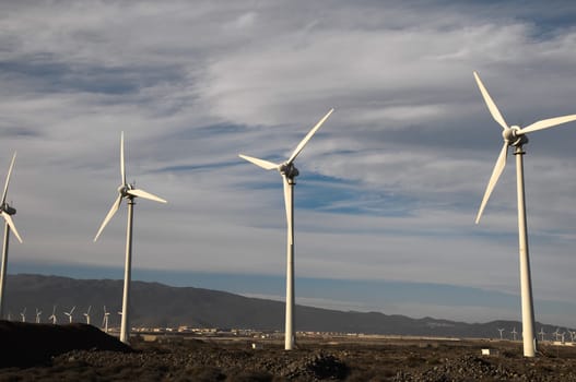 Eletric Power Generator Wind Turbine over a Cloudy Sky