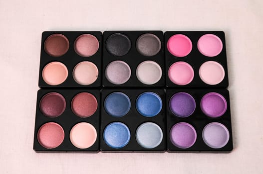 Make-up Palette Of Colorfully Eyeshadows Over White Background