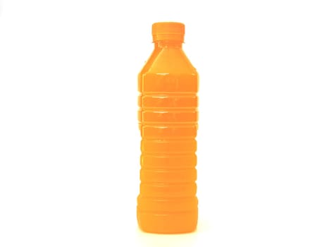 orange juice in plastic bottle on background