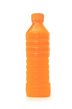 orange juice in plastic bottle on background