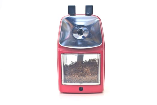 red pencil sharpener on white background