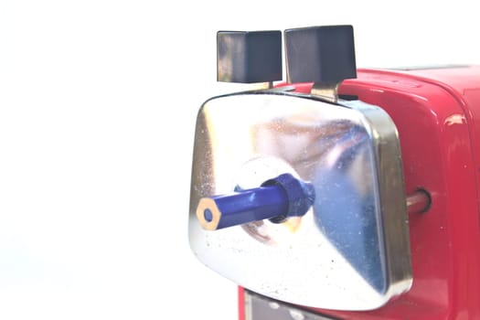 red pencil sharpener on white background