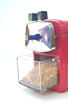 red pencil sharpener on white background
