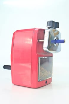red pencil sharpener on white background