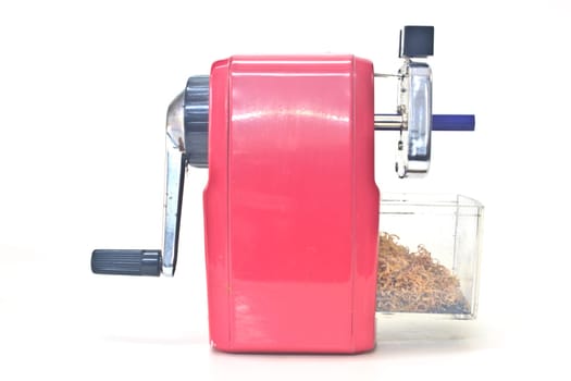 red pencil sharpener on white background