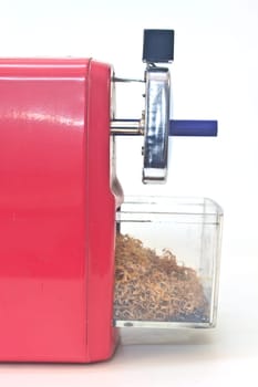 red pencil sharpener on white background