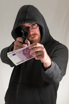Black Dressed Young Man Holding a Pistol Gun