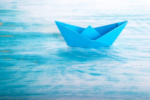 A Origami Paper Boat alone in the Sea