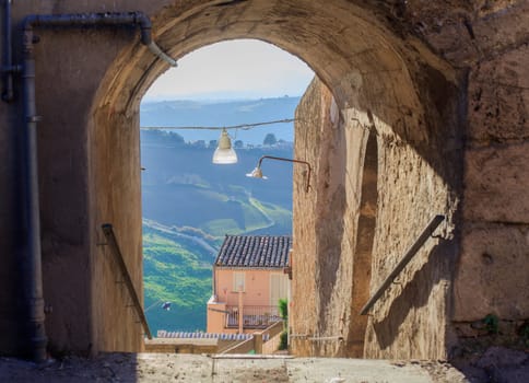 View of arch in Leonforte, baroque town in Sicily
