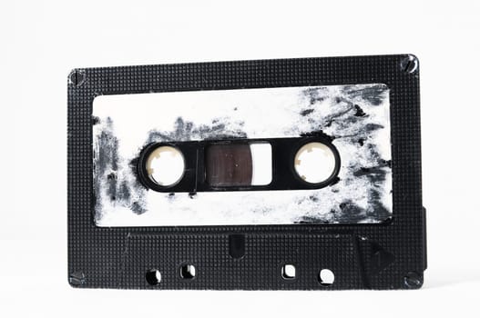 Ancient Vintage Used Musicassette over a White Background