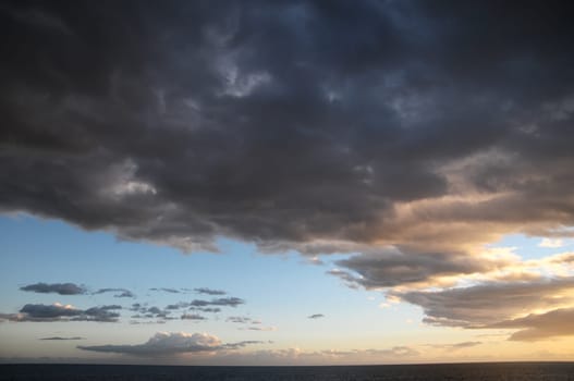 Cloudscape, Colored Clouds at Sunset near the Ocean