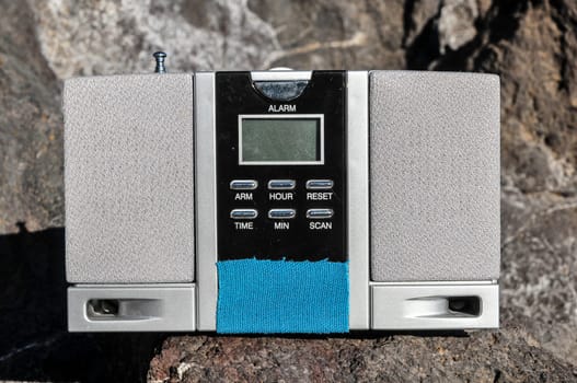 Old Vintage Two Speakers Gray Radio on the Rocks