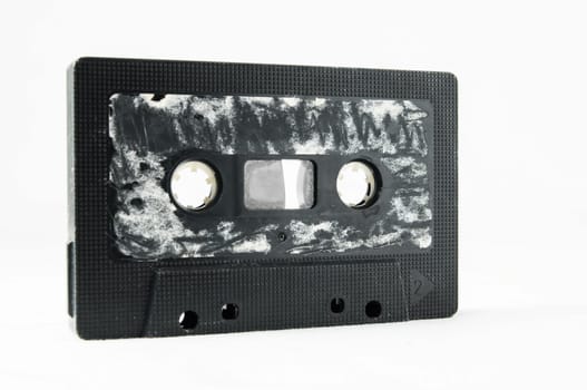 Ancient Vintage Used Musicassette over a White Background
